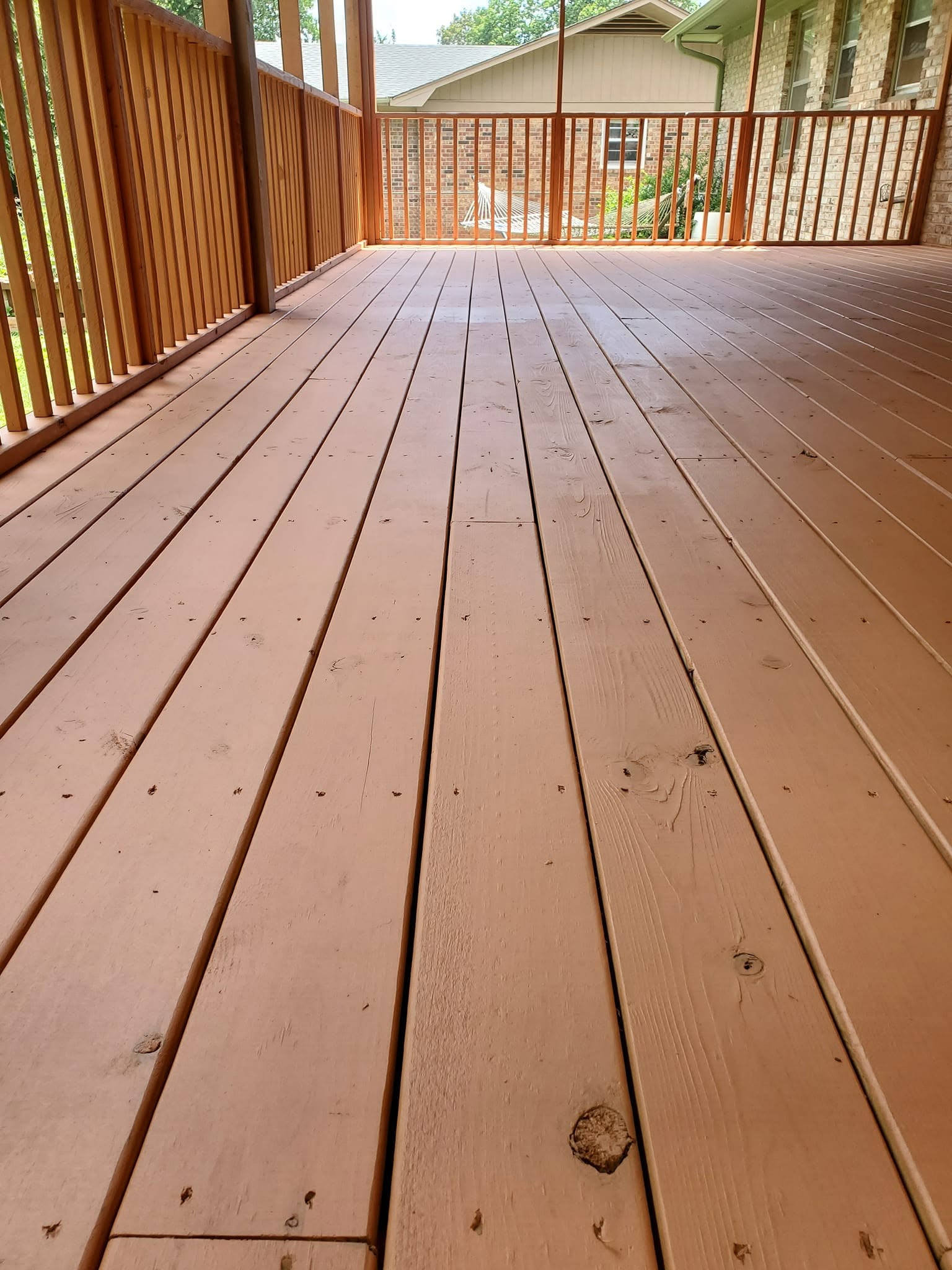 Freshly stained wood deck completed by Paint Pro